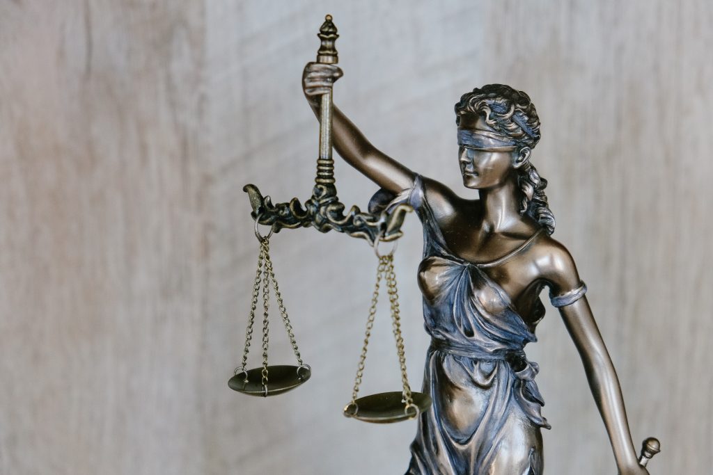 Image of lady justice holding the scales