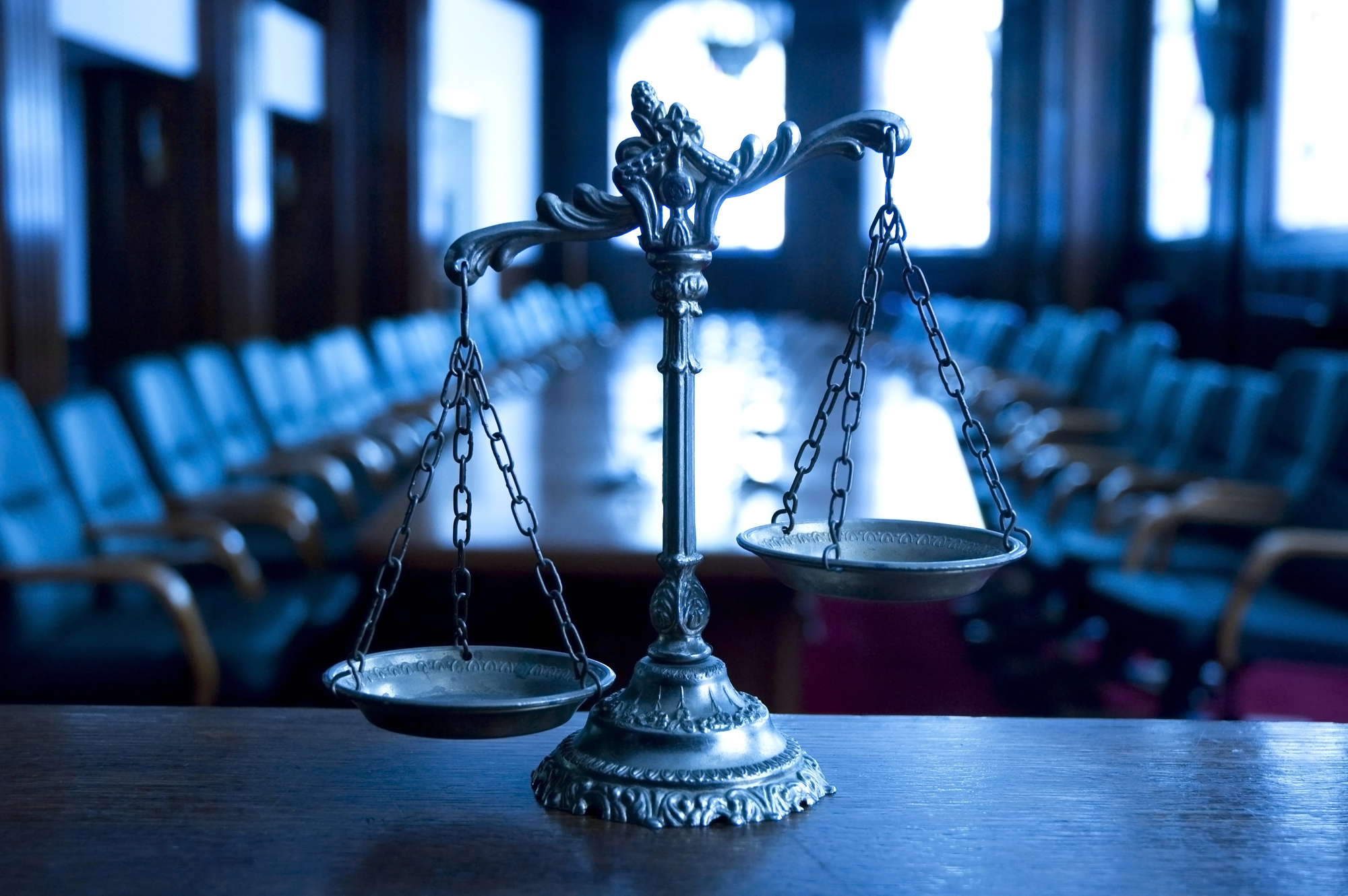 Scales of justice in the conference room of a criminal defense lawyer